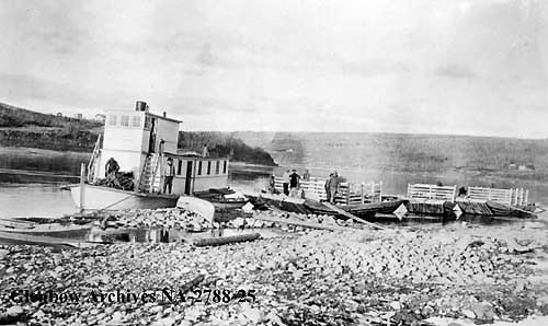 Tug and scows on Athabasca River, Alberta, 1911.